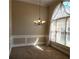 Bright dining area with wainscoting and a large window for natural light at 5035 Harbor Ridge Dr, Buford, GA 30518