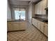 Well-appointed kitchen with white cabinets, an island, and a gas cooktop at 5035 Harbor Ridge Dr, Buford, GA 30518