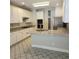 Well-lit kitchen featuring white cabinets, granite countertops, and stainless steel appliances at 5035 Harbor Ridge Dr, Buford, GA 30518
