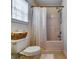 Bathroom with a shower and tub combination and a toilet with a basket at 7750 Carnegie Dr, Fairburn, GA 30213