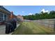 Large, private backyard with a wooden fence and lush green lawn at 2435 Hickory Station Cir, Snellville, GA 30078