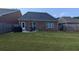 Spacious backyard featuring a patio area with outdoor furniture and a grill at 2435 Hickory Station Cir, Snellville, GA 30078