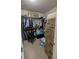 Walk-in closet with clothing racks and boxes for storage at 2435 Hickory Station Cir, Snellville, GA 30078