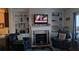 Living room features a fireplace flanked by built-in shelves, and comfortable seating at 2435 Hickory Station Cir, Snellville, GA 30078