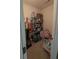Walk-in pantry offering ample storage space with shelving units filled with supplies at 2435 Hickory Station Cir, Snellville, GA 30078