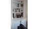 Built-in shelves featuring decorative items and storage within a living space at 2435 Hickory Station Cir, Snellville, GA 30078