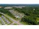 Aerial view of new home community with winding streets, mature trees, pool and clubhouse at 349 Garnet Dr, Acworth, GA 30101