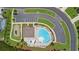 Aerial view showcasing the community pool, clubhouse, playground and parking amenities at 349 Garnet Dr, Acworth, GA 30101