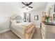 Cozy bedroom with a decorative headboard, soft carpet, and large window allowing for ample natural light at 349 Garnet Dr, Acworth, GA 30101