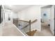 Hallway showcasing wood-trimmed staircase and open view to multiple bedrooms or flex spaces at 349 Garnet Dr, Acworth, GA 30101