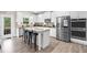 Modern kitchen featuring stainless steel appliances, white cabinets, granite countertops, and island with bar seating at 349 Garnet Dr, Acworth, GA 30101