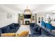 Cozy living room featuring a fireplace, comfortable seating, and an open-concept design at 349 Garnet Dr, Acworth, GA 30101