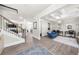 Open-concept living room with coffered ceilings, hardwood floors, and staircase access at 349 Garnet Dr, Acworth, GA 30101