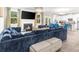 Spacious living room with a fireplace, large TV, and open layout connecting to the kitchen at 349 Garnet Dr, Acworth, GA 30101