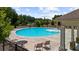 Community pool with lounge chairs and seating area is perfect for relaxing and enjoying the outdoors at 349 Garnet Dr, Acworth, GA 30101
