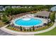 Aerial view of large community pool with lounge chairs, umbrellas, and well-maintained landscaping at 349 Garnet Dr, Acworth, GA 30101