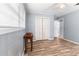 Bedroom featuring laminate flooring, closet space, and window at 3927 Buck Rd, Powder Springs, GA 30127