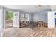 Bright living room with new wood-look floors and open view of the front yard at 3927 Buck Rd, Powder Springs, GA 30127