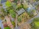 A bird's-eye view of the property in a neighborhood with mature trees, showcasing a spacious lot and serene setting at 2994 Baker Ridge Nw Dr, Atlanta, GA 30318
