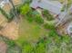 Aerial view of a private backyard oasis, enveloped by mature trees and landscaping at 2994 Baker Ridge Nw Dr, Atlanta, GA 30318