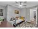 Bedroom includes daybed, ceiling fan, graphic rug, and desk area, offering relaxation and functionality at 2994 Baker Ridge Nw Dr, Atlanta, GA 30318