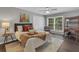Bedroom showcasing natural light from large window, bed with accent pillows and a ceiling fan at 2994 Baker Ridge Nw Dr, Atlanta, GA 30318