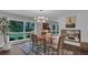 Dining room featuring modern lighting, large windows, and stylish decor at 2994 Baker Ridge Nw Dr, Atlanta, GA 30318