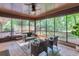 Inviting screened porch with ample seating and views of the surrounding greenery at 2994 Baker Ridge Nw Dr, Atlanta, GA 30318