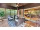 Cozy screened-in porch with comfortable seating, offering a relaxing outdoor space at 2994 Baker Ridge Nw Dr, Atlanta, GA 30318