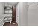 Spacious walk-in closet with built-in shelving, wood floors, and a brown storage cabinet for maximum organization at 2994 Baker Ridge Nw Dr, Atlanta, GA 30318