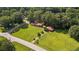 Charming home with a red roof on a lush green lot at 6674 Cowan Mill Rd, Winston, GA 30187