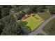 Aerial of property showing home with mature trees, lawn and proximity to streets at 6674 Cowan Mill Rd, Winston, GA 30187