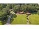 Aerial view of a charming home nestled amongst mature trees on a large lot at 6674 Cowan Mill Rd, Winston, GA 30187