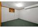 Unfinished basement room with painted concrete walls and an exposed ceiling at 6674 Cowan Mill Rd, Winston, GA 30187