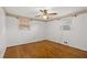 Comfortable bedroom features hardwood floors, ample natural light, and a ceiling fan for a restful environment at 6674 Cowan Mill Rd, Winston, GA 30187