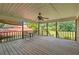 Relaxing covered porch features a ceiling fan and ample space for outdoor seating at 6674 Cowan Mill Rd, Winston, GA 30187