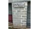 A close-up of the cinderblock wall of the garage featuring a sign reading 'Paw Paw's Garage' at 6674 Cowan Mill Rd, Winston, GA 30187