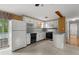 Functional kitchen with white cabinets, black appliances, and a view to the backyard at 6674 Cowan Mill Rd, Winston, GA 30187