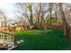Beautiful backyard featuring a lush lawn, a wooden deck, and a privacy fence at 83 Ormond Se St, Atlanta, GA 30315