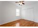 Bedroom with hardwood floors, white walls, and a closet, creating a serene and functional living space with natural lighting at 83 Ormond Se St, Atlanta, GA 30315