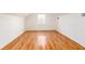 Bright bedroom featuring a large window, hardwood floors and white painted walls at 83 Ormond Se St, Atlanta, GA 30315