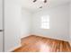 Clean bedroom with wood floors, white walls, and ample natural light, presenting a versatile and comfortable living space at 83 Ormond Se St, Atlanta, GA 30315
