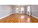 Open living room with hardwood floors, neutral paint, and a view of the front yard at 83 Ormond Se St, Atlanta, GA 30315