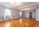 Large living room boasting hardwood floors, modern lighting, and fresh paint at 83 Ormond Se St, Atlanta, GA 30315