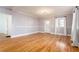 Spacious living room featuring hardwood floors, fresh paint, and ample natural light at 83 Ormond Se St, Atlanta, GA 30315