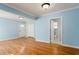 Bright living room with hardwood floors, light blue walls, and white trim, showcasing a welcoming and airy space at 83 Ormond Se St, Atlanta, GA 30315