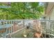 Relaxing balcony provides a serene outdoor space with a quaint table and chairs at 2110 Augusta Se Dr # 204, Marietta, GA 30067