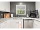 Updated kitchen with granite countertops, stainless steel appliances, and a window above the sink at 2110 Augusta Se Dr # 204, Marietta, GA 30067