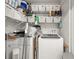 Functional laundry room includes a washer, dryer, and shelving for storage and organization at 2110 Augusta Se Dr # 204, Marietta, GA 30067