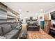 Open-concept living room seamlessly connects to the modern kitchen with stainless steel appliances at 2110 Augusta Se Dr # 204, Marietta, GA 30067